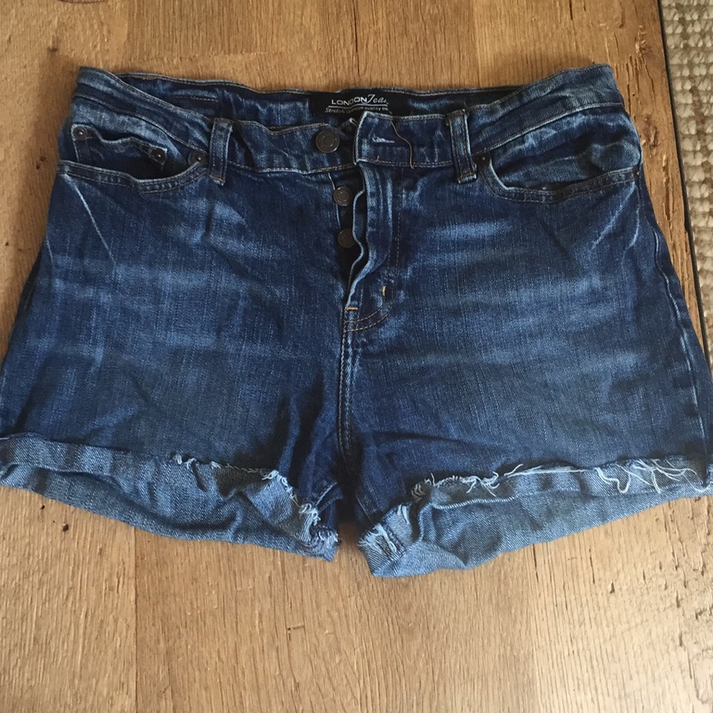 Medium rise stretch denim shorts.